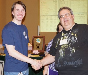 Andrew Emerick receives the first place plaque from GM Jim Vroom